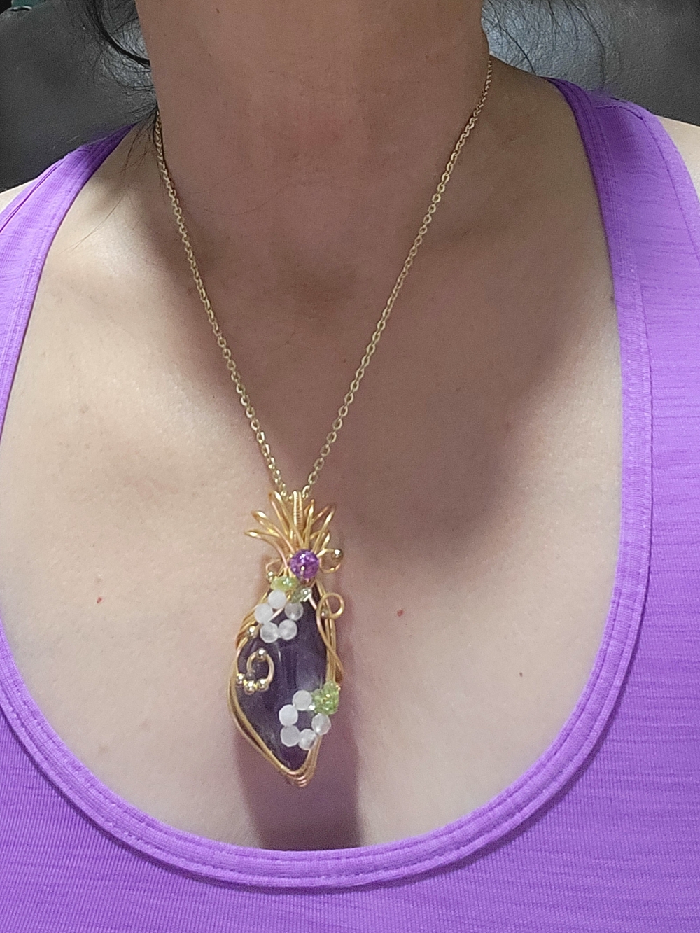 Handmade wire-wrapped amethyst crystal pendant with small gemstone bead accents